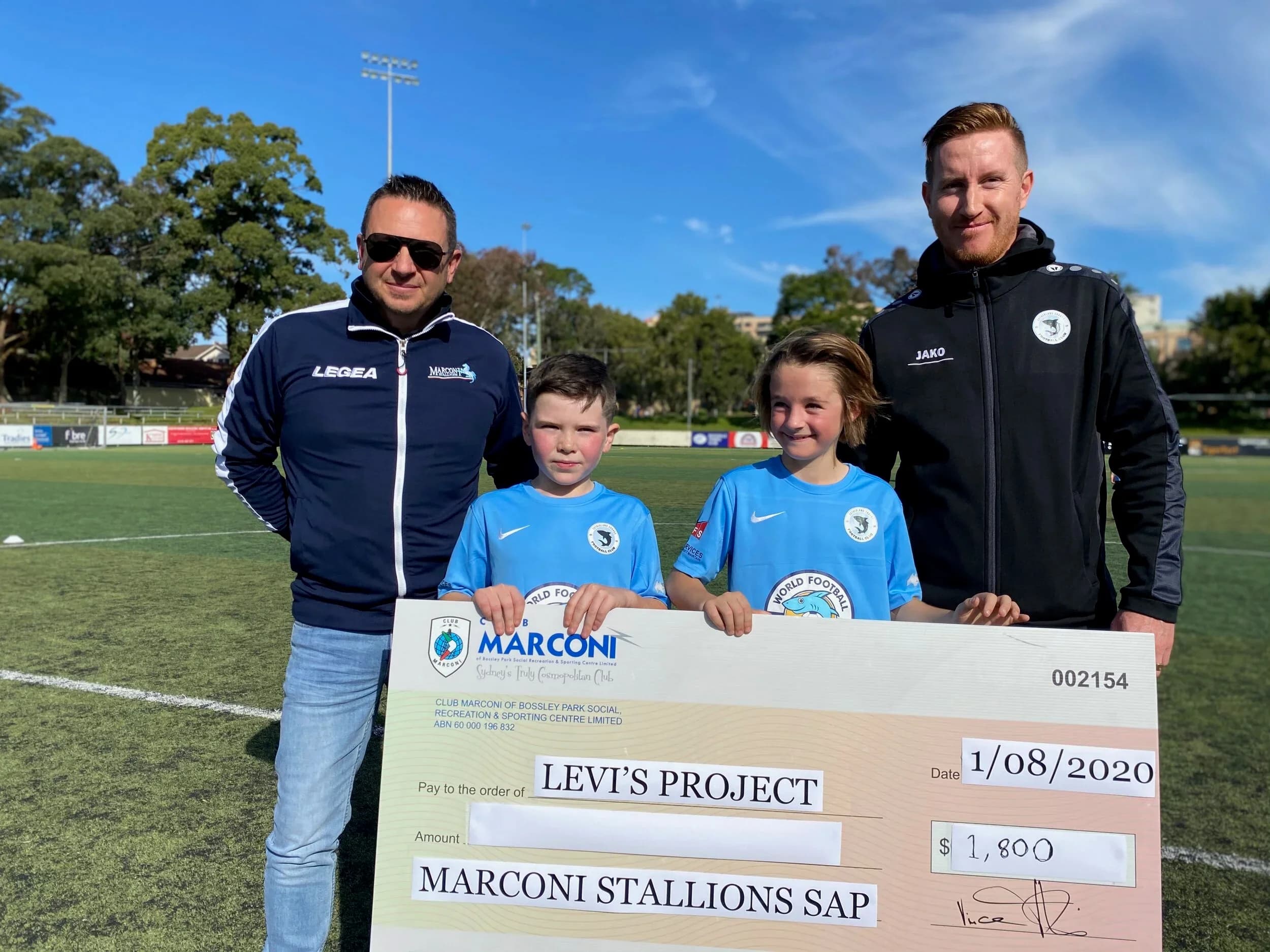 Marconi Stallions SAP players present a cheque for Levi's Project