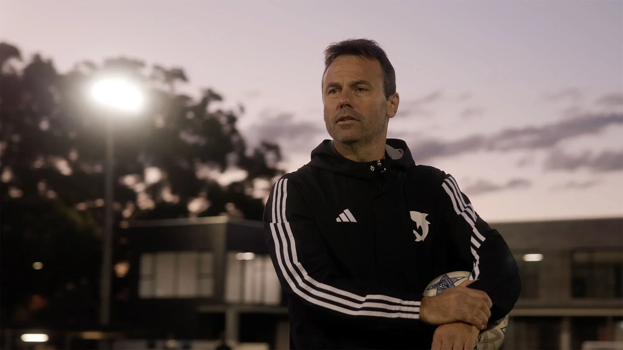 Joey, in a black club jacket, at Seymour Shaw at dusk