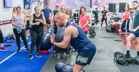 Marc Warren training with a medicine ball at an F45 studio