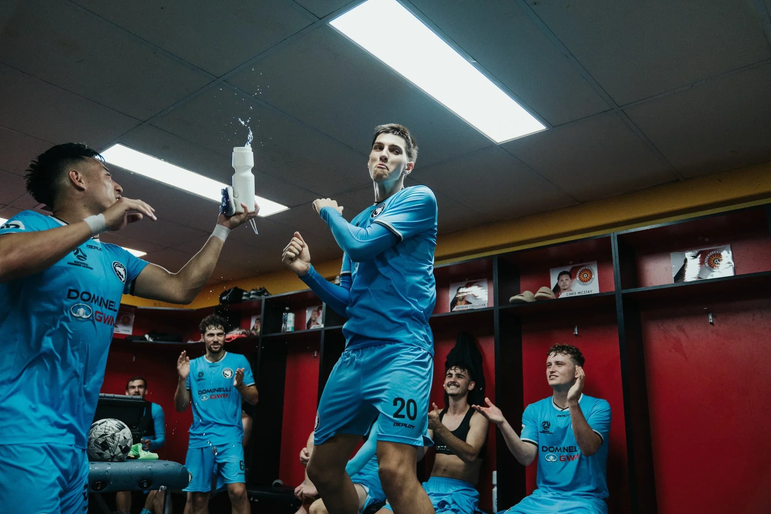 Sharks players celebrate the win in the dressing room