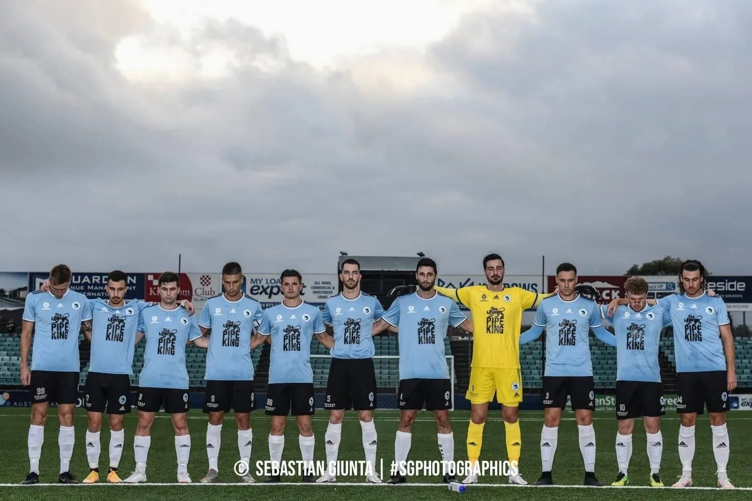 The Sharks line up in sky blue before the match