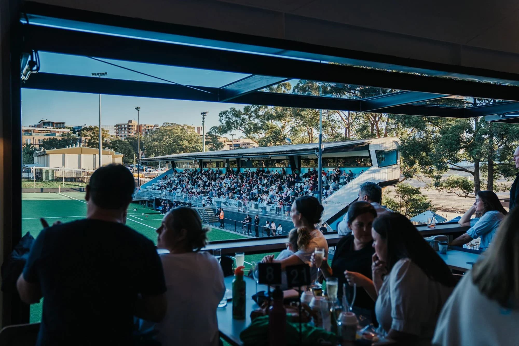 Fans watch the match from Smithy's balcony over the pitch