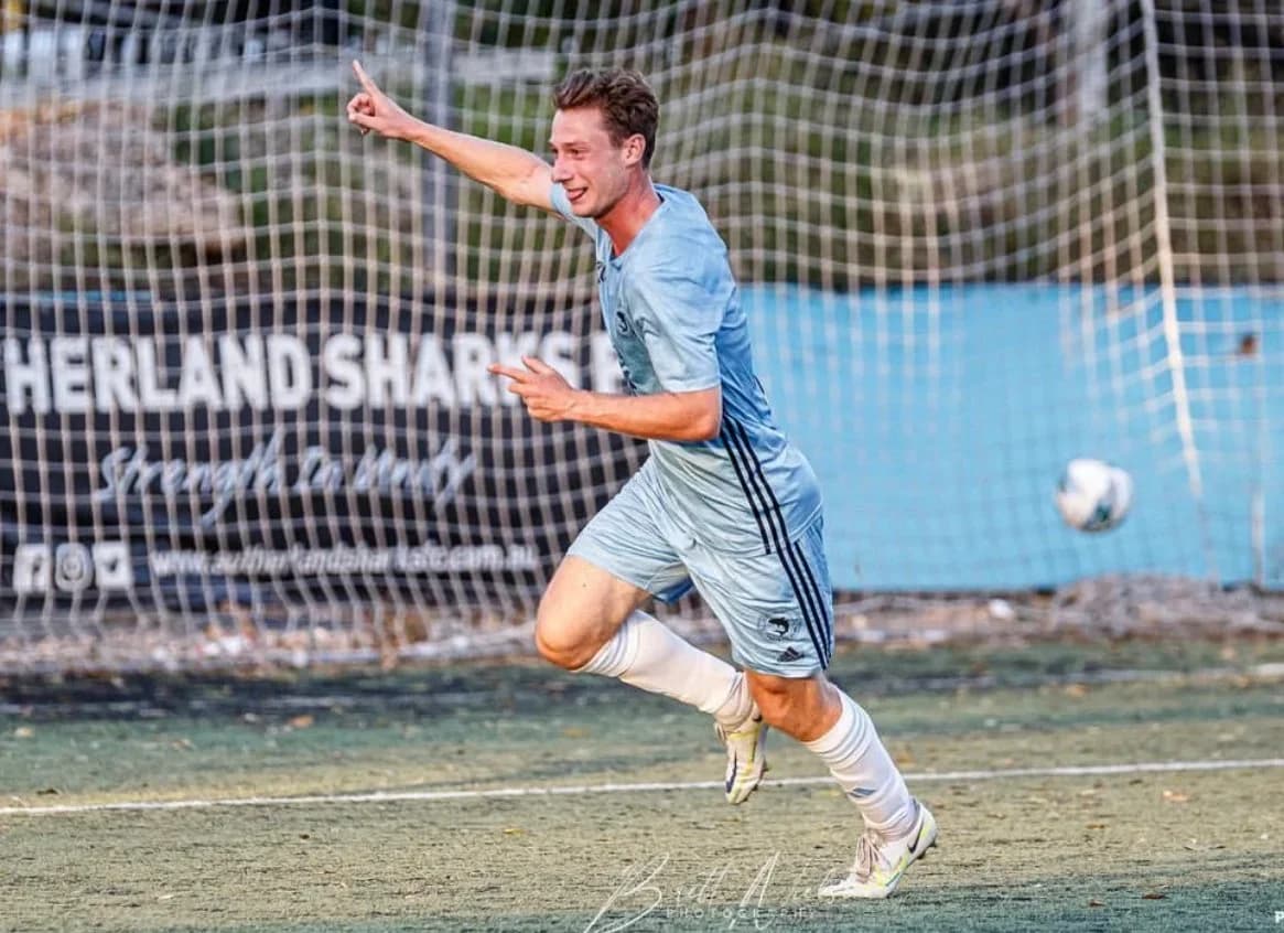 A Sharks player in sky blue wheels away in celebration against Spirit