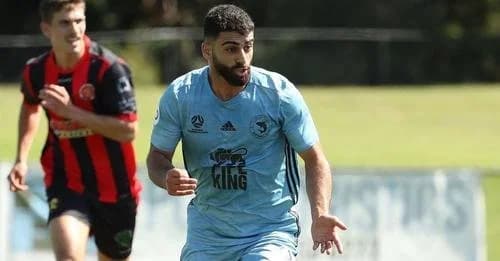 A Sharks player in sky blue alongside a Marconi player in red and black