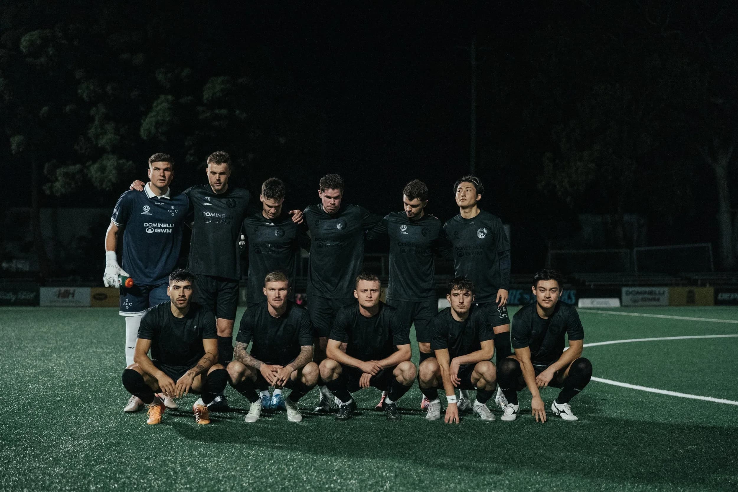 The Sharks team photo in black training tops at night