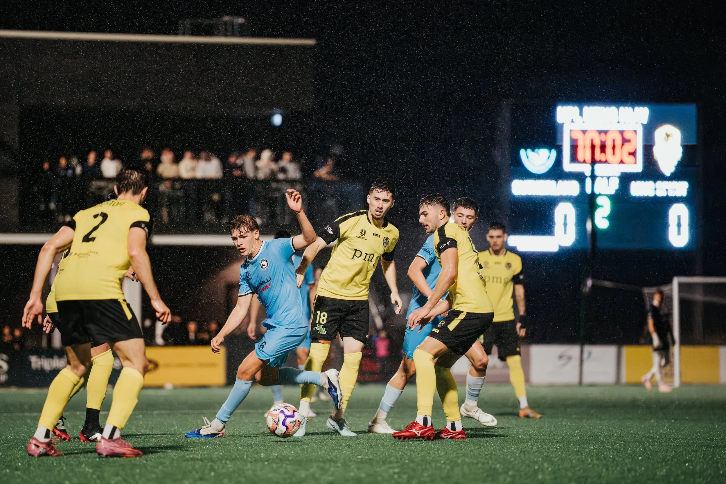 Sharks players celebrate as the scoreboard shows the Sharks a goal ahead of Spirit
