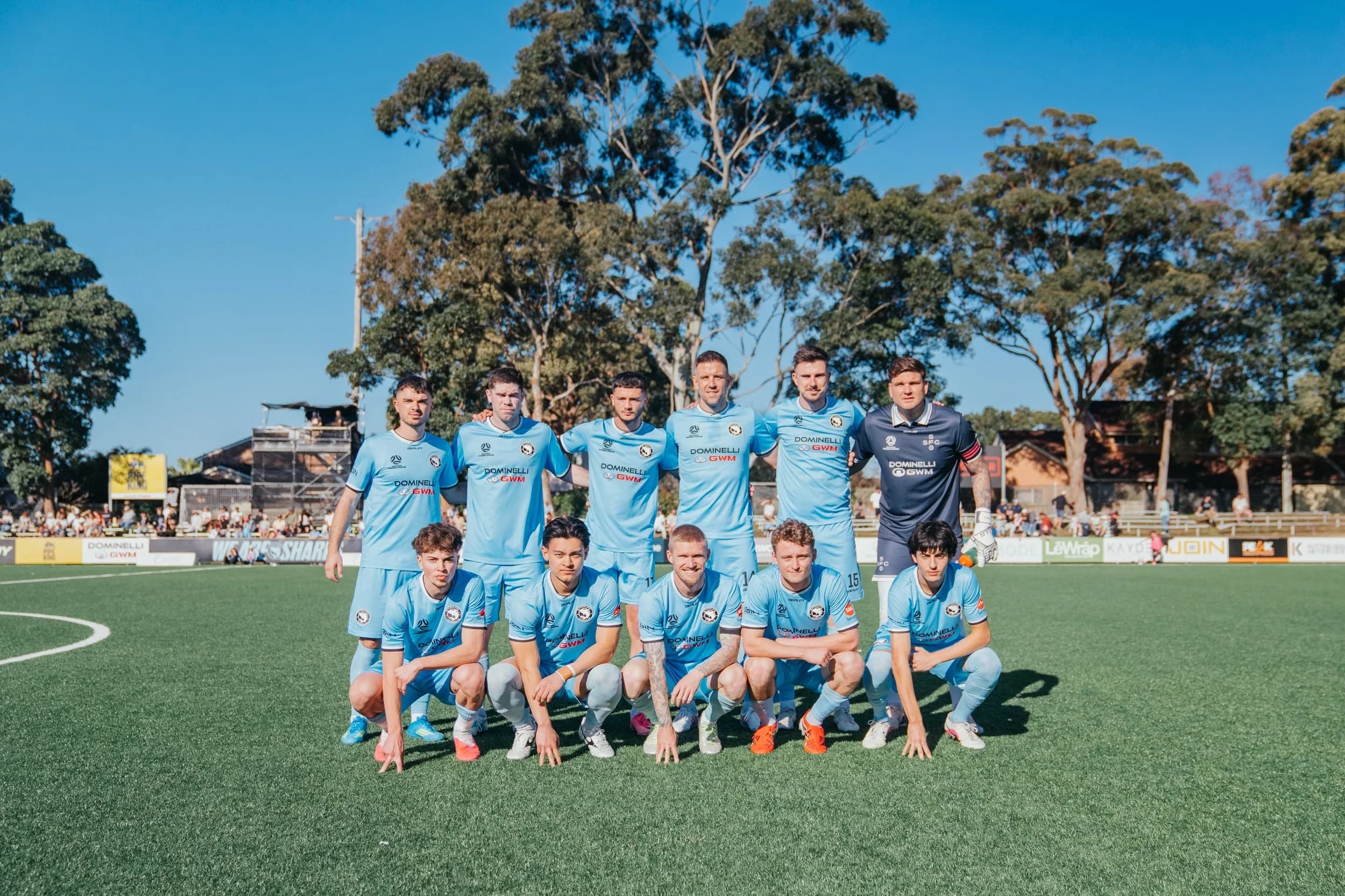 The Sharks team posing for a team photo on the pitch