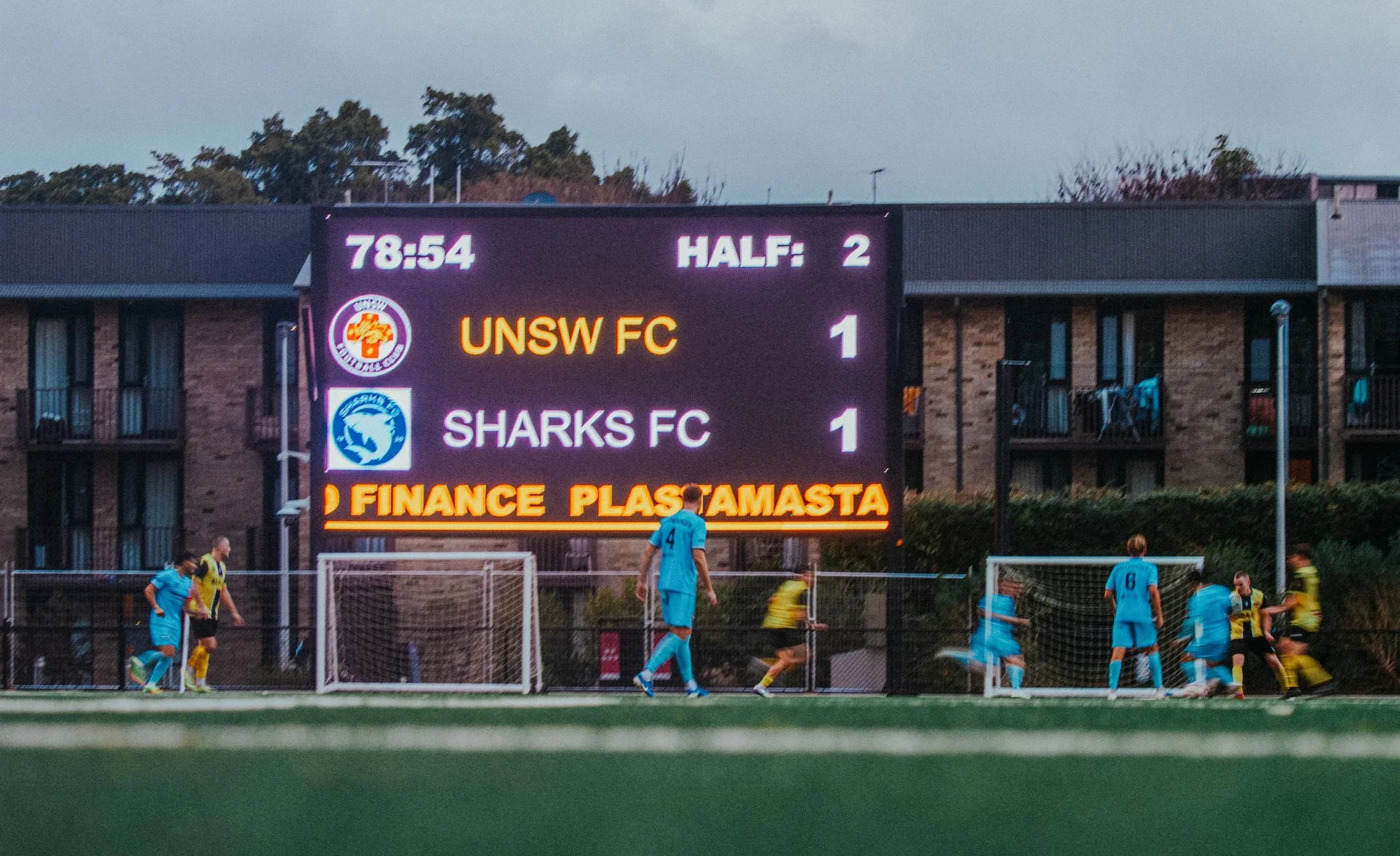 The scoreboard shows UNSW FC 1, Sharks FC 1 in the second half