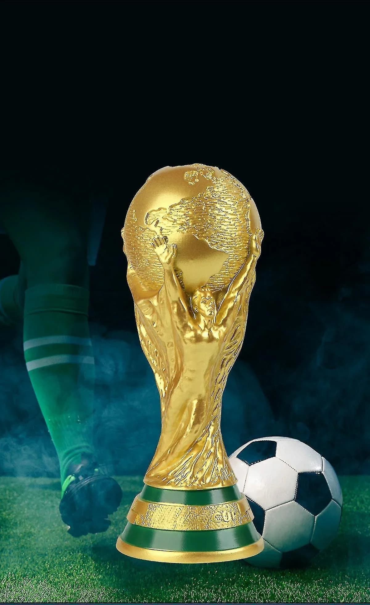 The World Cup trophy beside a football