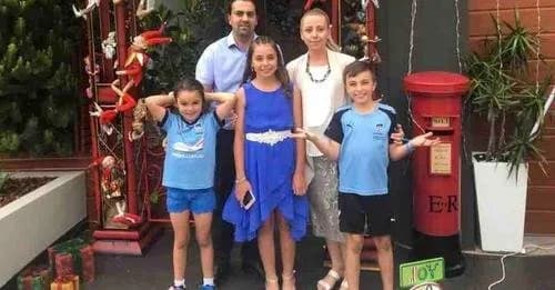 Tony Khoury's family standing together outside their home